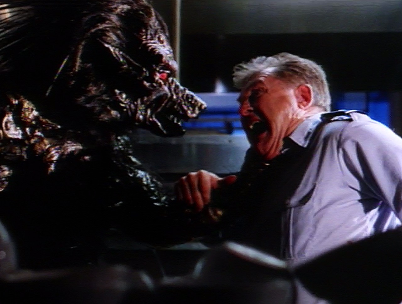 Barry Bostwick attacked by a cyborg werewolf in Project: Metalbeast (1994)