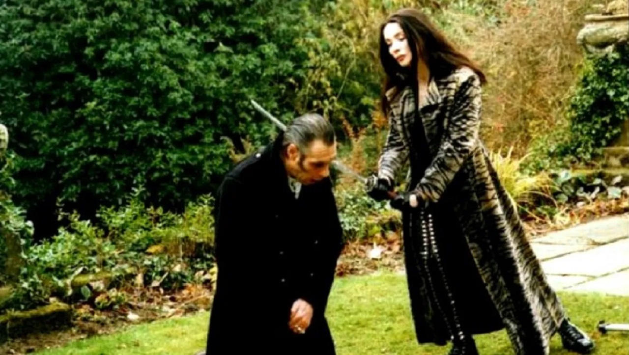 Lilith Silver (Eileen Daly) goes to behead Sethune Blake (Christopher Adamson) in Razor Blade Smile (1998)