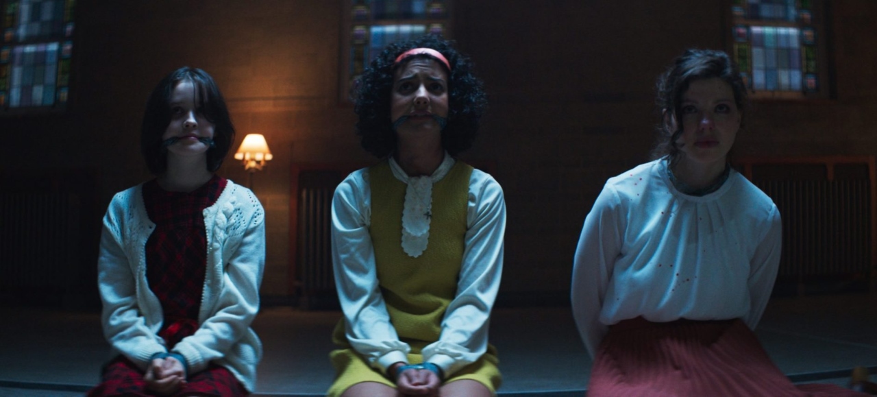 Georgia Acken, Madison Baines and Chloe Levine in The Sacrifice Game (2023)