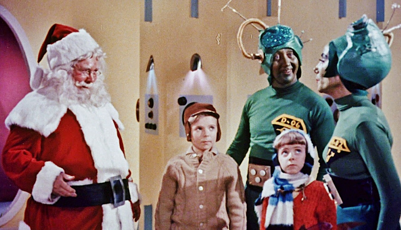Santa (John Call) and Earth children Victor Stiles and Donna Conforti in Santa Claus Conquers the Martians (1964)