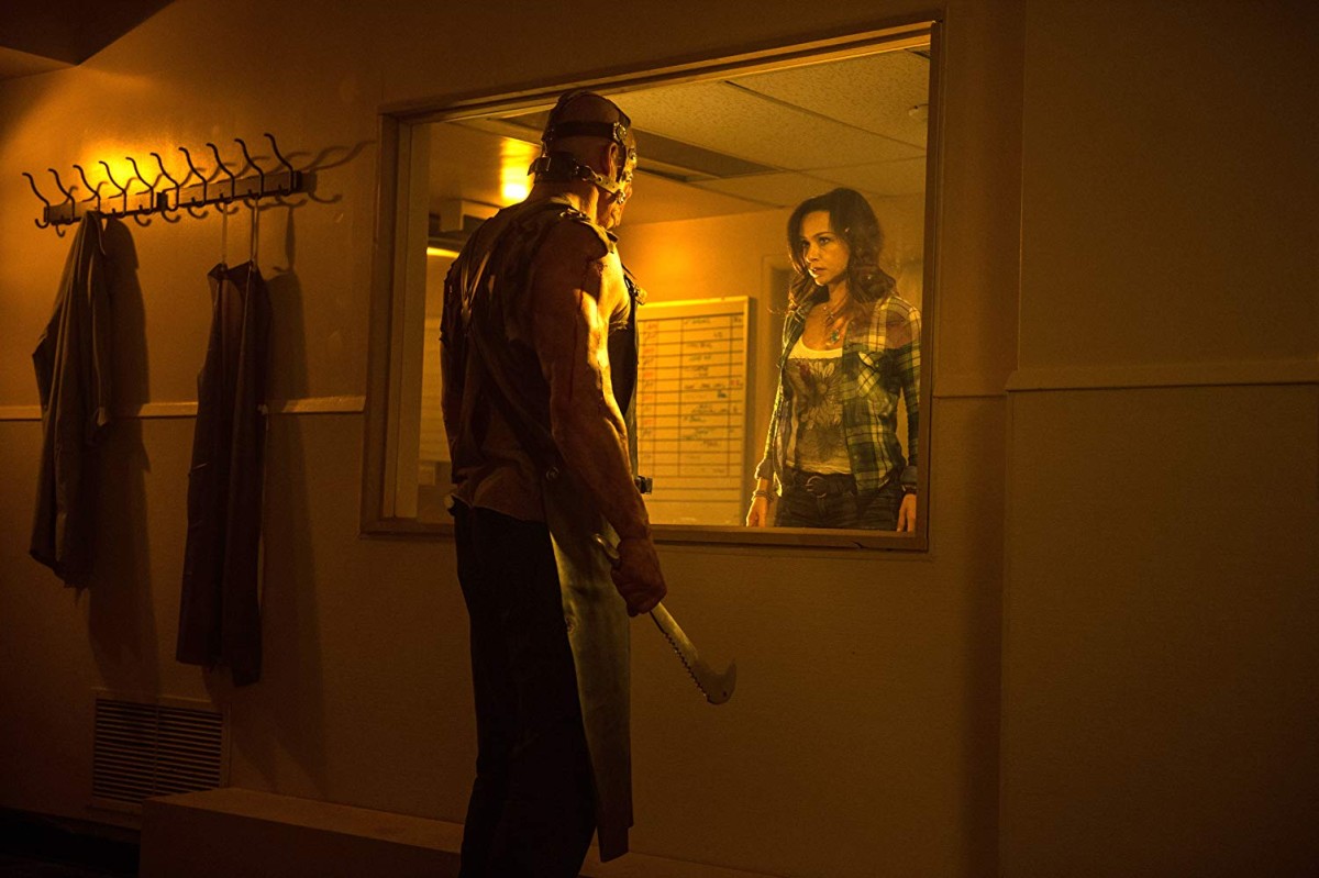A revived Jacob Goodnight (Glenn “Kane” Jacobs) threatens Danielle Harris in See No Evil 2 (2014)