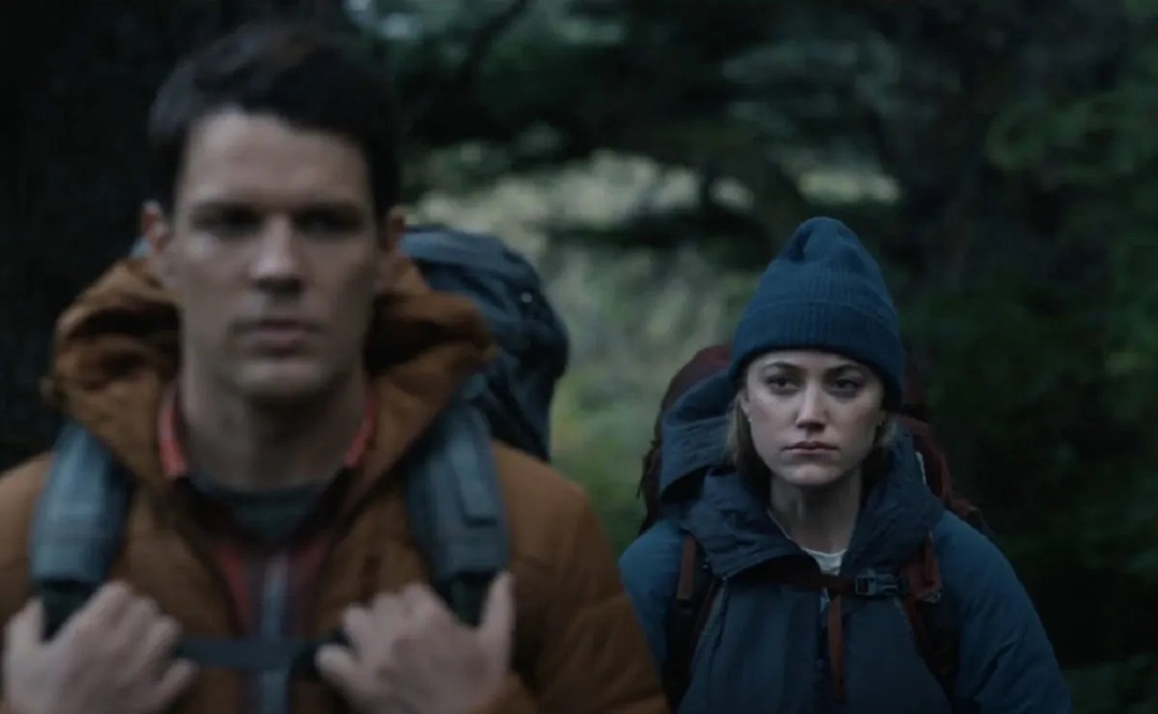 Jake Lacy and Maika Monroe go hiking in the woods in Significant Other (2022)