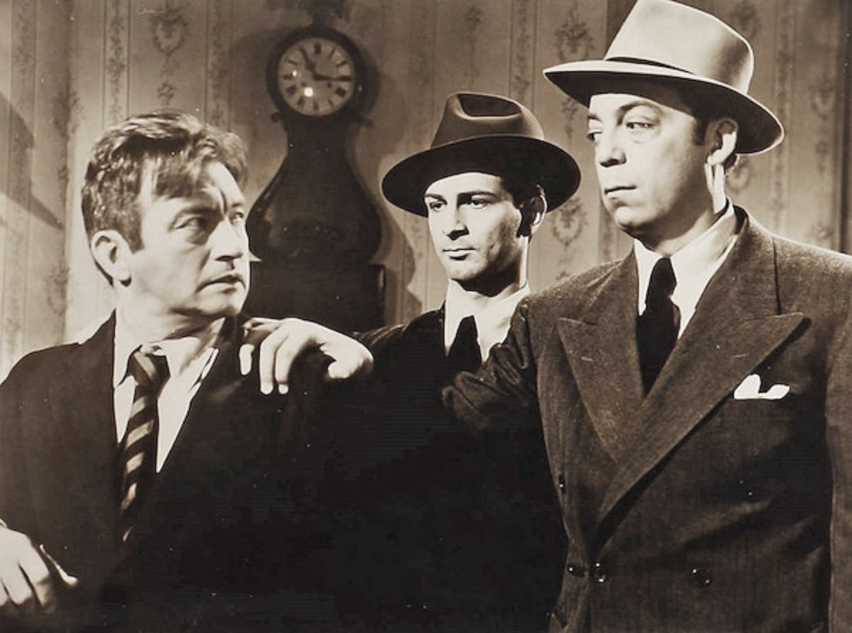 Claude Rains is arrested by Martin Kosleck and Milton Kibbee in Strange Holiday (1945)
