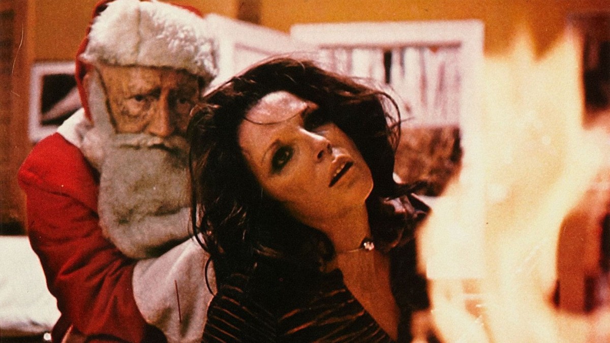 Joan Collins attacked by a Maniac Santa (Oliver MacGreevy) in the All Through the House episode of Tales from the Crypt (1972)