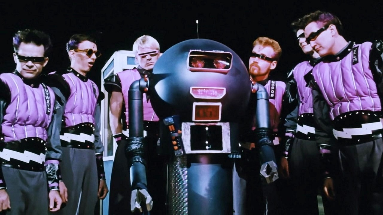 The aliens and the robot in Voyage of the Rock Aliens (1984)