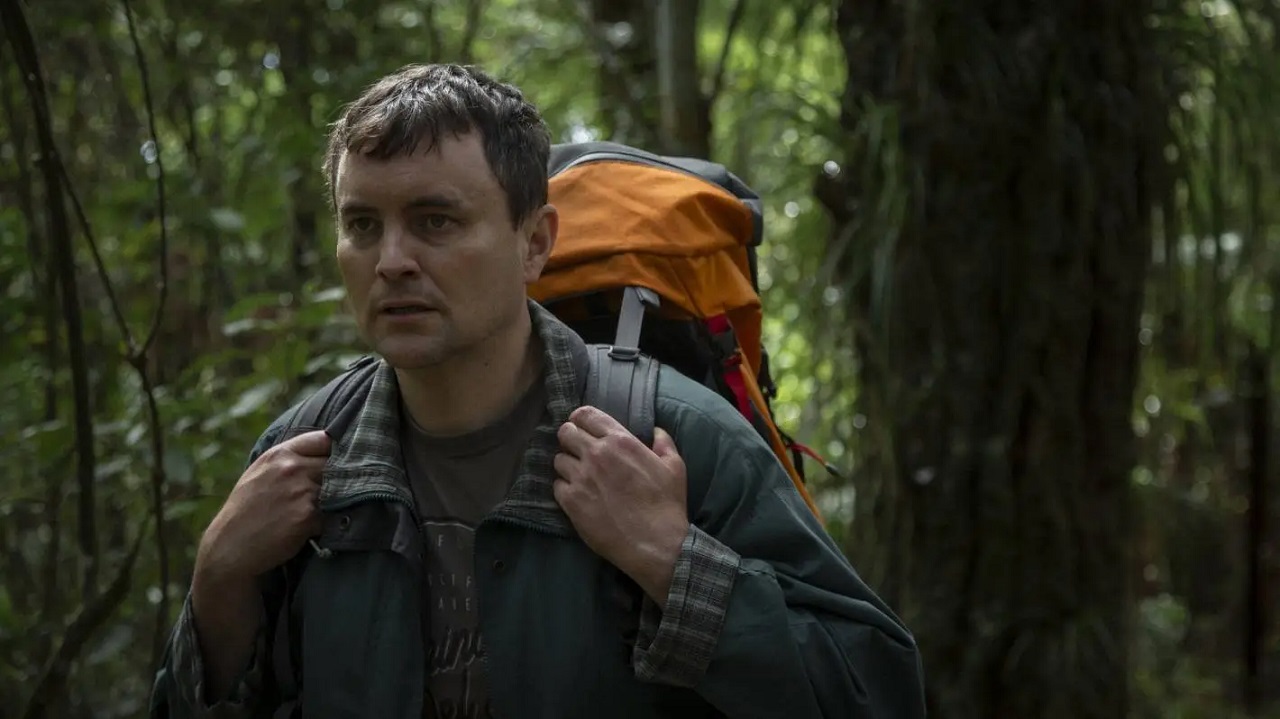 Ian (Tom Sainsbury, also the film's director and writer) in the bush in Loop Track (2023)