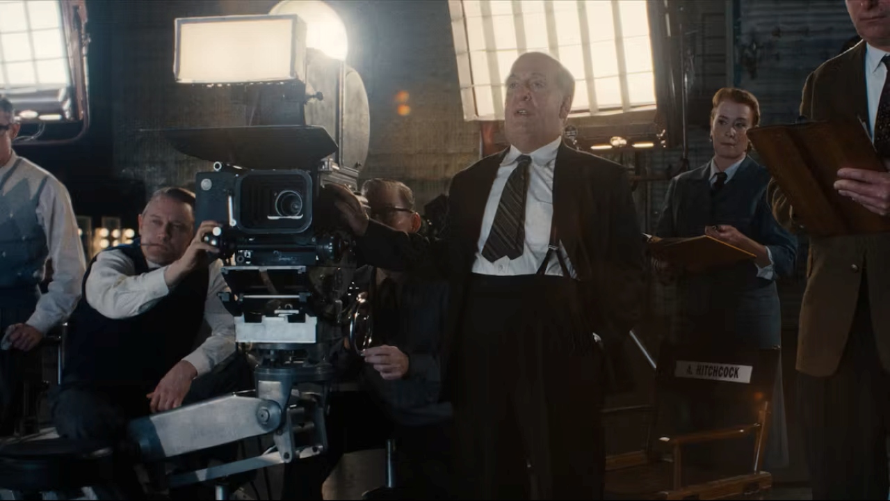 Tom Hollander as Alfred Hitchcock in Monster: The Ed Gein Story (2025)